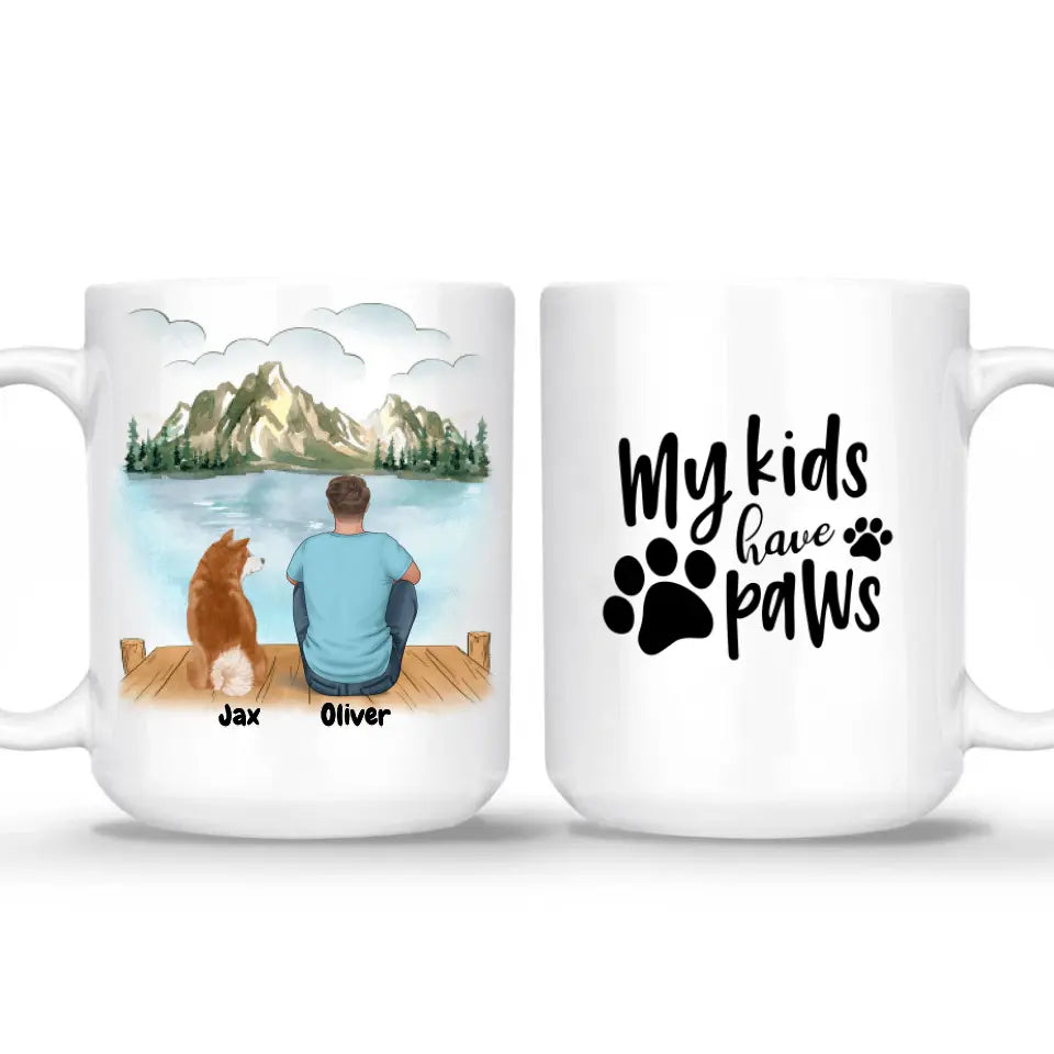 Personalized pet and owner coffee mug set – custom dog and owner gift with a scenic illustration of a man and his dog sitting by a lake. Features pet names, breeds, and the quote "My kids have paws." Perfect for pet lovers, dog owners, and unique gifts. Microwave & dishwasher safe. Order now!